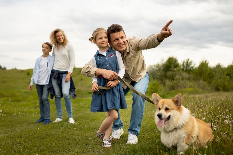 happy-family-with-dog-nature-full-shot_23-2148996538.jpg
