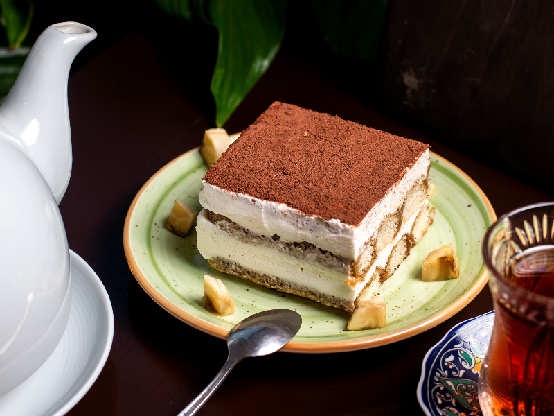 tiramisu-cake-with-cacao-powder-top-served-with-tea.jpg